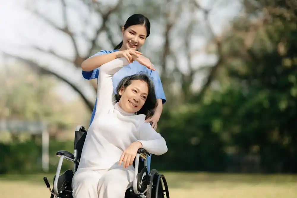 LOLOMA support worker with a participant outdoors